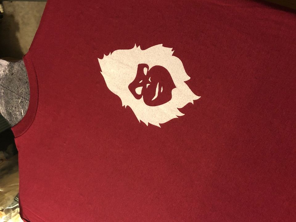 Maroon t-shirt with a white MAD Monkey logo print